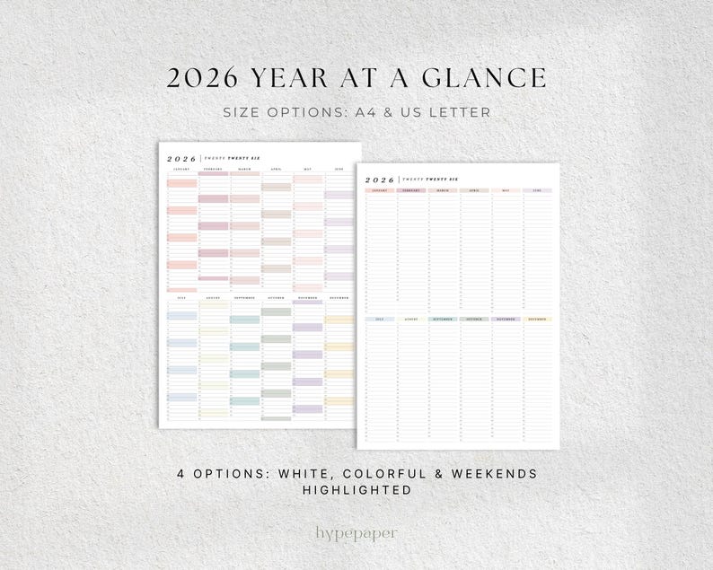 May include: Two 2026 year-at-a-glance planners. One has a colorful layout with pastel blocks, the other is a blank lined version. Text at the top reads "2026 YEAR AT A GLANCE" and "SIZE OPTIONS: A4 & US LETTER". The bottom text says "4 OPTIONS: WHITE, COLORFUL & WEEKENDS HIGHLIGHTED".