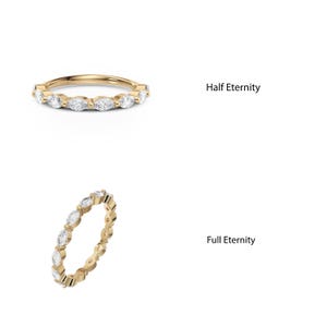 May include: Two gold rings with marquise-shaped diamonds. The top ring has diamonds on half of the band, labeled "Half Eternity". The bottom ring has diamonds on the entire band, labeled "Full Eternity".