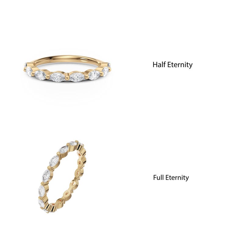 May include: Two gold rings with marquise-shaped diamonds. The top ring has diamonds on half of the band, labeled "Half Eternity". The bottom ring has diamonds on the entire band, labeled "Full Eternity".