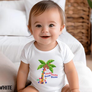May include: A white baby onesie with a colorful palm tree graphic and the text "Chicka Chicka Boom Boom!" printed on the front.