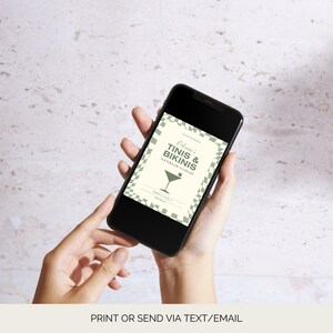 May include: A smartphone displaying a digital invitation for a party. The invitation is white with green text and a green martini glass icon. The text reads "Olivia's Tinis & Bikinis Backyard Bash!"