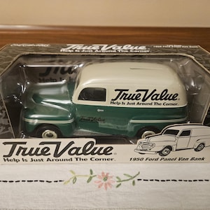 May include: A green and white 1950 Ford Panel Van Bank with the words "True Value. Help Is Just Around The Corner." on the side. The bank is a 1:25 scale model.