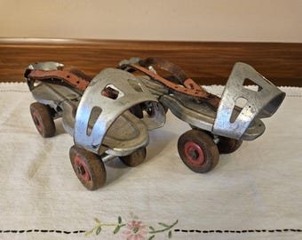 Vintage Globe Skate Corp roller skates with metal construction and leather straps. #30