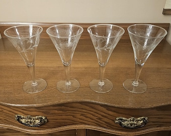 Vintage set of four clear glass stemmed glasses with etched wheat pattern.