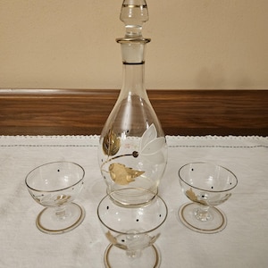 Vintage Hand Painted Gold White and Black Glass Liquor Decanter with Stopper and 3 Cordial glasses.