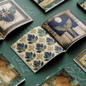 May include: A collection of five hardback books with intricate designs. The books feature a variety of themes, including Egyptian mythology, nature, and abstract patterns. The covers are adorned with gold accents and detailed illustrations.
