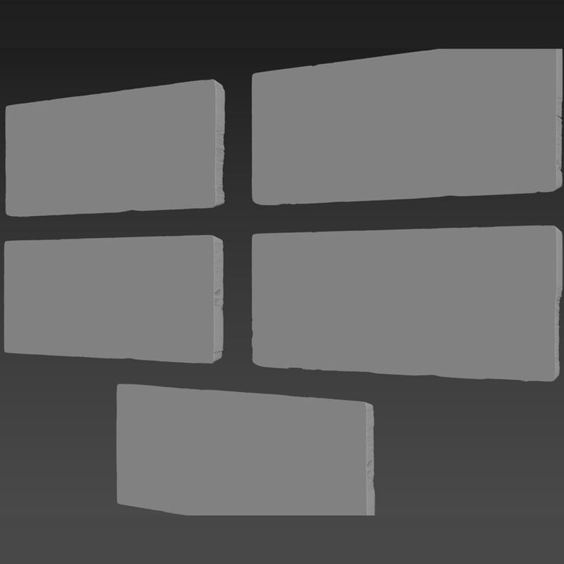 May include: A set of five gray rectangular tiles arranged in a staggered pattern. The tiles are made of a rough, textured material.