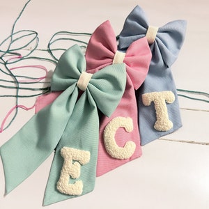 Handmade, linen, punch needle embroidered hair bow personalized with initials.