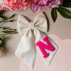 Handmade, linen, punch needle embroidered hair bow personalized with initials.