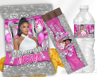 May include: A party favor bundle featuring a pink and silver design with the text "Happy Birthday Megan" and the number "27". The bundle includes a chip bag, chocolate bar, and water bottle with a photo of a woman.