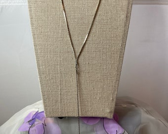 Long Y drop silver tone necklace with small acrylic clear disc on the end. Perfect for parties!