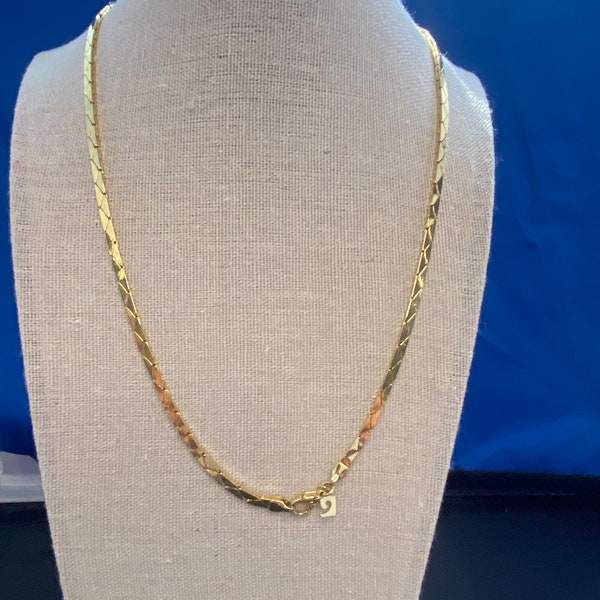 Pierre Cardin vintage , gold plated necklace and bracelet. Logo attached. Snake like chain.