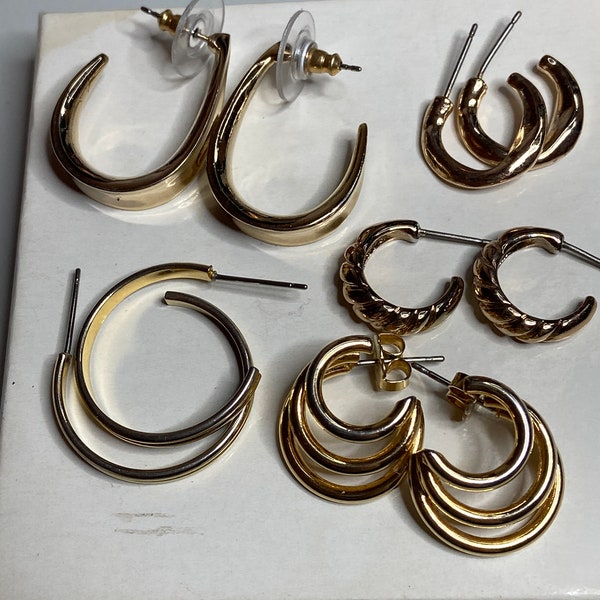 5 pairs of gold tone post hoops. Various sizes and designs. Great for any occasion! * note there may be some wear as they were pre loved*