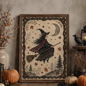 May include: A framed rectangular wall art print featuring a witch with long dark hair wearing a pointed hat and a flowing cloak, riding a broomstick across a night sky with a crescent moon, stars, autumn leaves, and pine trees.