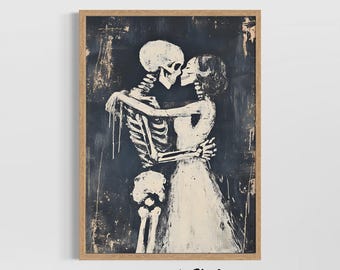 May include: A framed art print featuring a black and white illustration of two skeletons embracing and kissing. The skeletons are depicted in a romantic pose, set against a dark, textured background. The artwork is signed "STUDIO LEXA ART".