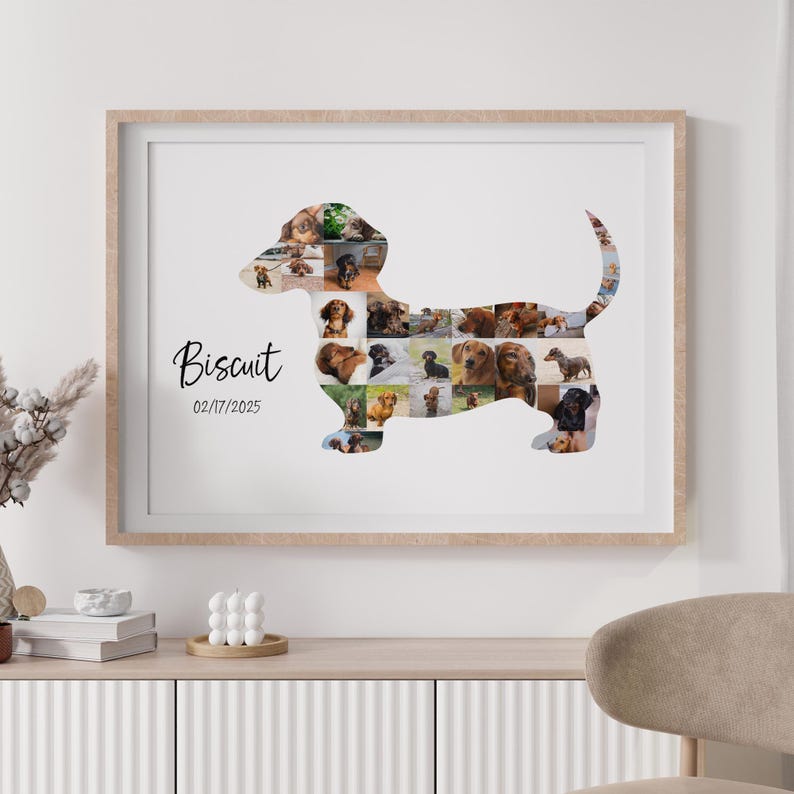 May include: A framed print with a dachshund shape composed of various dog photographs. The print is inscribed with the name "Biscuit" and the date "02/17/2025". The frame is light wood, and the background is white. A unique pet portrait.