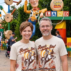 Sheriff Woody PNG, Toy Story Sublimation, Reach For The Sky, Disney Vacation Tee, Toy Story Land DTF, Hollywood Studios, Best In The West, Toy Story Family, Disney World PNG, Pixar Cowboy Design, Disney Trip Transfer, Retro Disney Shirt, Digital Download, Bucking Bronco Graphic, Flying Saucer, Vintage Western Art, Toy Story Birthday, Disney Bound Outfit, Retro Theme Park Tee, Sublimation Design File, DTF Transfer Print, Sheriff Badge PNG, Andys Room Toys, Toy Story Party, Disney Sublimation