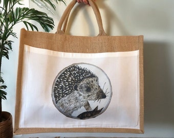 Sustainable, large jute shopper with a hedgehog design. Large pocket on the front. Eco tote bag.