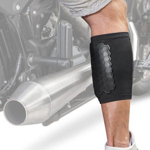 Pode incluir: Manga de panturrilha preta com acolchoamento hexagonal para andar de motocicleta.