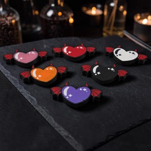 May include: A light blue blazer with a white and light blue patterned design. The blazer has a classic two-button closure and notched lapels. The image shows the blazer on a hanger.