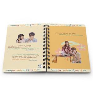 May include: A yellow and orange notebook with a spiral binding. The front cover features a photo of two people and the text "Twenty Five Twenty One 스물 다섯 스물 하나". The back cover features a photo of two people and the text "네가 어디에 있든 내가 가서 닿을게 Wherever you are, I will reach you" and "Twenty Five Twenty One 스물 다섯 스물 하나".