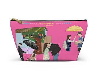 May include: Pink zippered pouch with a colorful illustration of characters from the Korean drama "Lovely Runner" with the title of the show in Korean and English. The illustration includes a couple kissing, a woman holding an umbrella, and a man holding a yellow umbrella.