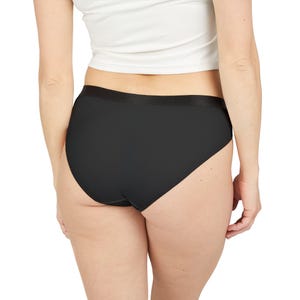 May include: Black underwear with a smooth, seamless design. The briefs have a high-waisted cut and a black elastic waistband. The image is a rear view of the underwear.