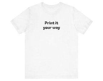 May include: A white t-shirt with the text "Print it your way" in black, centered on the front. The shirt has short sleeves and a crew neck.