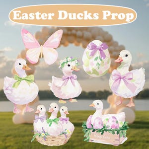 May include: A set of Easter duck props, including a pink butterfly, a duck with a flower crown, a duck with a green bow, a duck with a purple bow, a duck with a purple bow and a basket of eggs, and a single egg with a purple bow. The props are painted in a watercolor style.