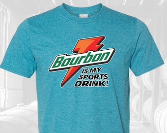 May include: A turquoise blue t-shirt with a graphic of a lightning bolt and the text "Bourbon is my sports drink!"