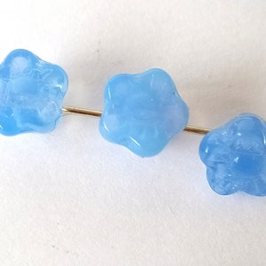 10 light blue glass beads in the shape of flowers image 4