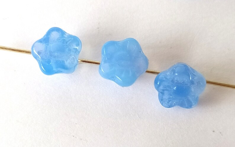 10 light blue glass beads in the shape of flowers image 4