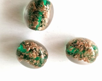 3 green handmade glass beads with copper-colored sprinkles