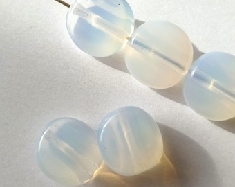 5 white semi-transparent glass beads