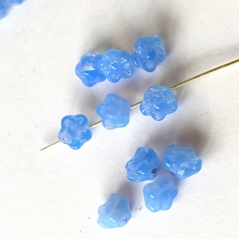 10 light blue glass beads in the shape of flowers image 6