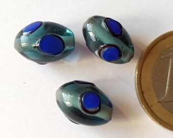 3 handmade blue olive shaped glass beads with bright blue circles