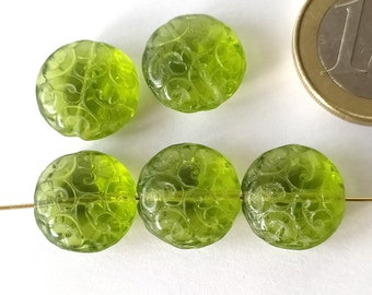 5 green round glass beads with ornament