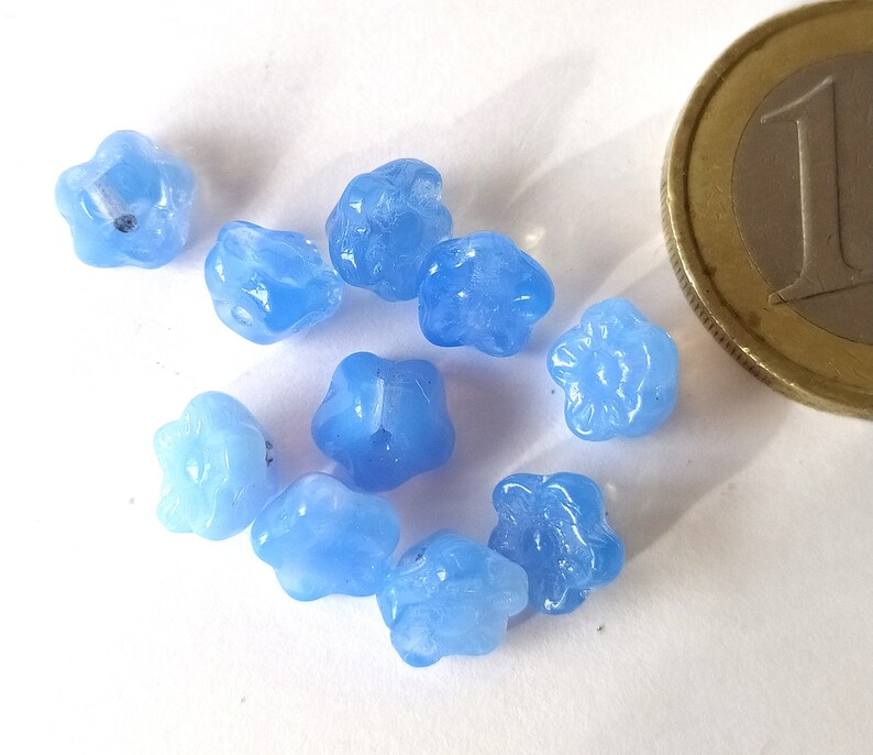 10 light blue glass beads in the shape of flowers image 3