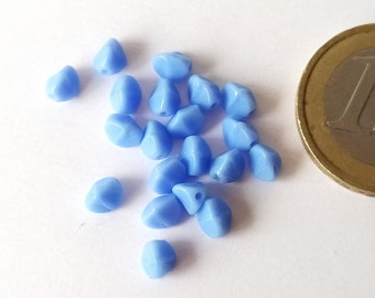 20 small light blue glass beads