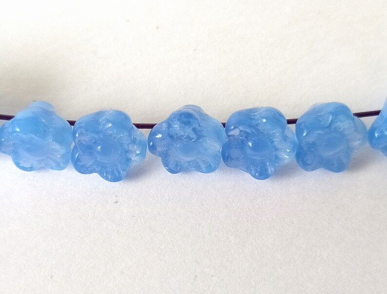 10 light blue glass beads in the shape of flowers image 2