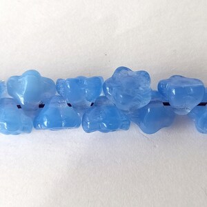 10 light blue glass beads in the shape of flowers image 5
