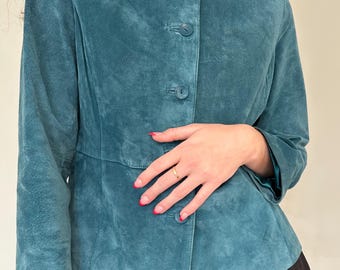 May include: A teal blue suede jacket with a button-up front and long sleeves.