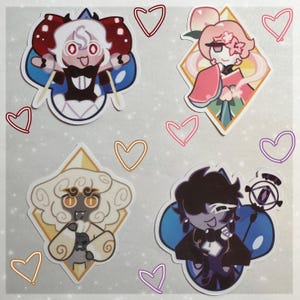 May include: Four colorful stickers featuring cartoon characters with different expressions. The stickers are shaped like diamonds and have a white background with pink hearts around them.