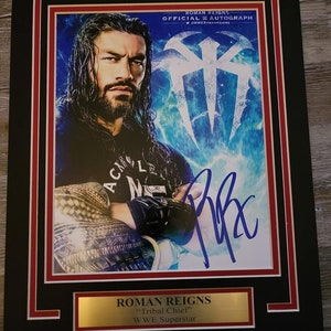 WWE ROMAN REIGNS autographed photo with double mat and name plate