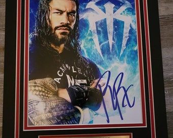 WWE ROMAN REIGNS autographed photo with double mat and name plate