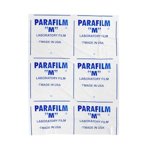 May include: White sheets of Parafilm M laboratory film with blue text. Each sheet has the brand name, "Parafilm M", and "Laboratory Film" printed on it, along with "Made in USA".