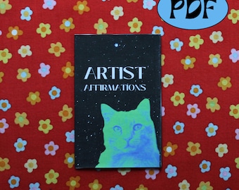 May include: A black and white booklet with the text "ARTIST AFFIRMATIONS" and a blue and green cat illustration on the cover. The booklet is on a red background with small yellow and pink flowers.