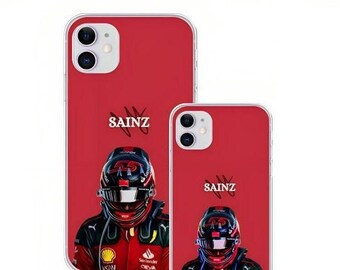 May include: Red iPhone case featuring a portrait of a race car driver in a helmet and racing suit. The name "SAINZ" is printed above the driver's head. The case is shown in two sizes.