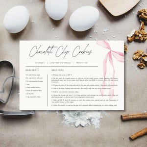 May include: Printable recipe card with a pink watercolor ribbon design for chocolate chip cookies. The recipe includes ingredients and directions for making 30 cookies.