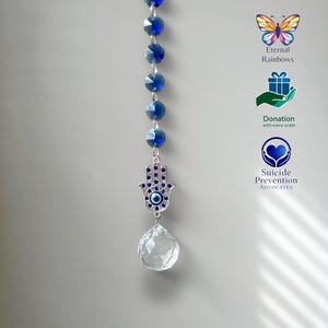 Atrapasueños de cristal con forma de mano de Hamsa, arcoíris, en caja de regalo con tarjeta y donación